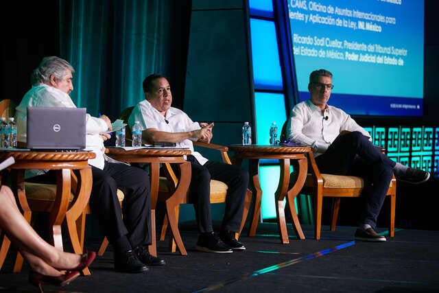 LATAM Conference Recap Photo - Panel discussion showing three speakers