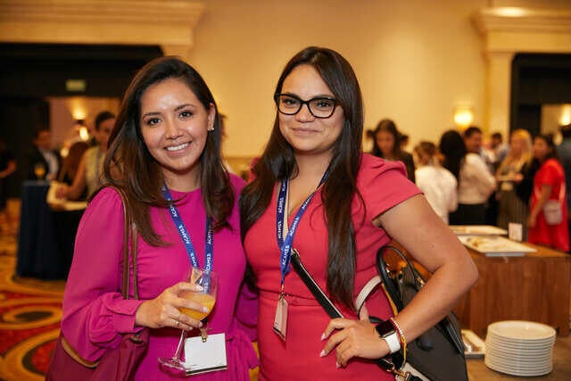 LATAM Conference Recap Photo - Two attendees in the networking hall