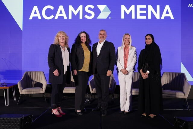 MENA Conference Recap Photo - Five panel speakers posing on stage