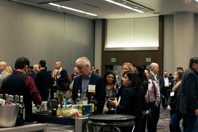 FinTech Conference Recap Photo - Attendees picking up refreshments