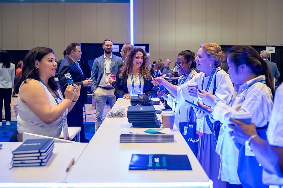 ACAMS Hollywood attendees being given ACAMS branded swag