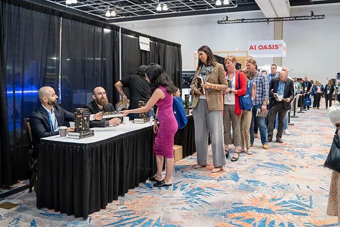 ACAMS Hollywood attendees lining up at a booth
