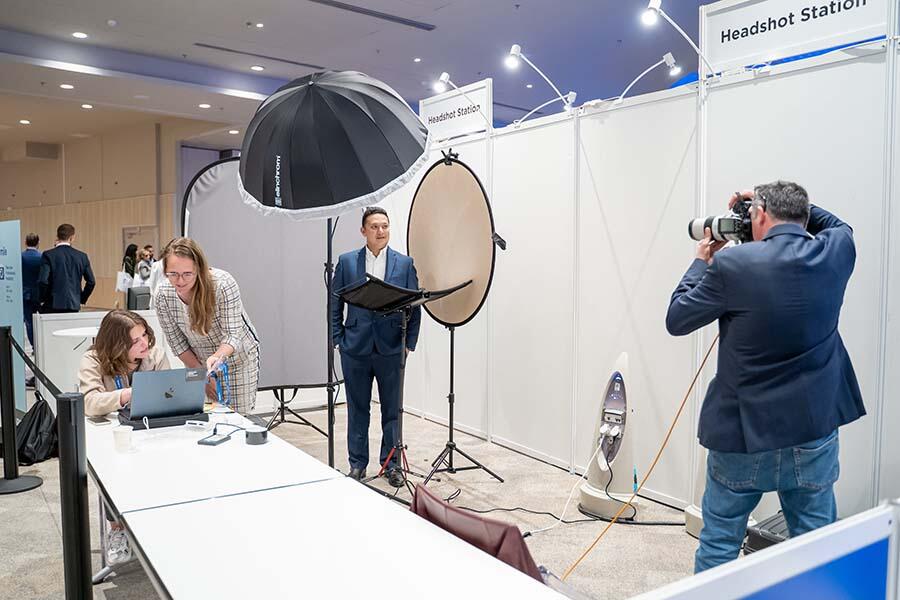Attendee getting professional headshots taken at the ACAMS Europe Assembly