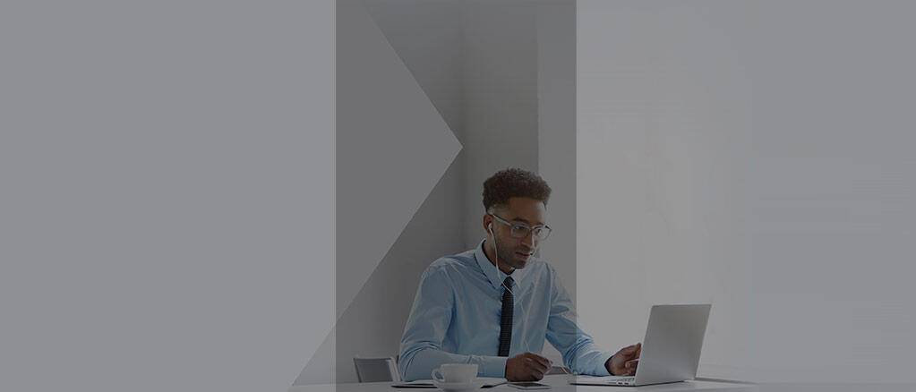 Business man attending a webinar on a laptop 