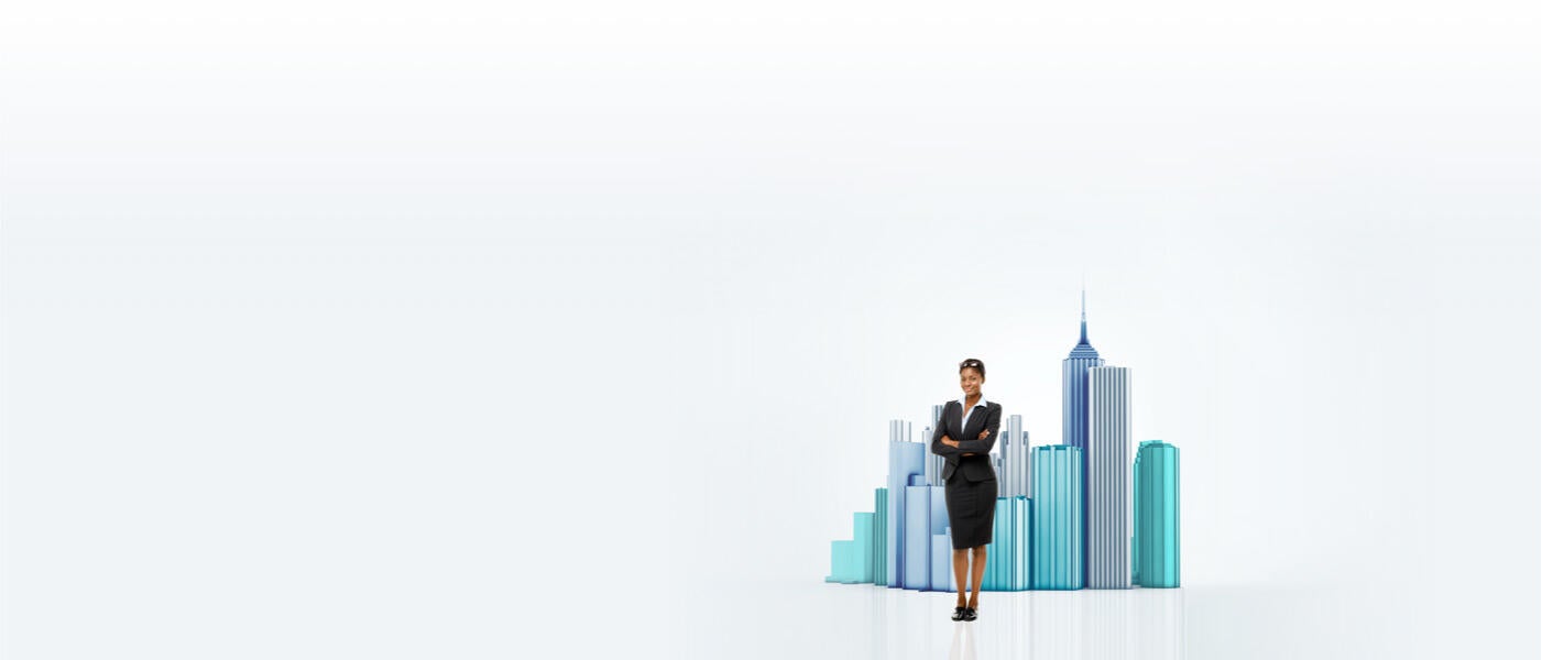 Confident business woman standing in front of miniature city